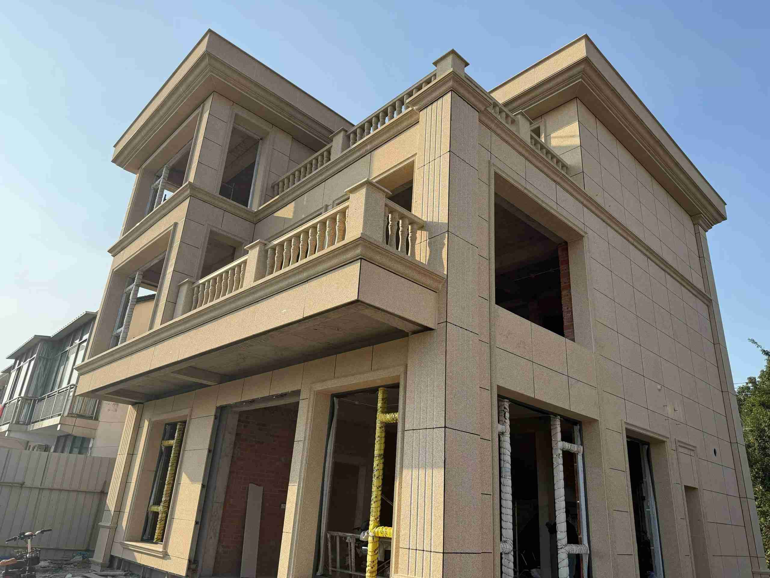 辽源 黄金麻花岗岩石材荔枝面外墙干挂效果展示